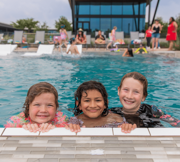 Girls smiling in the pool